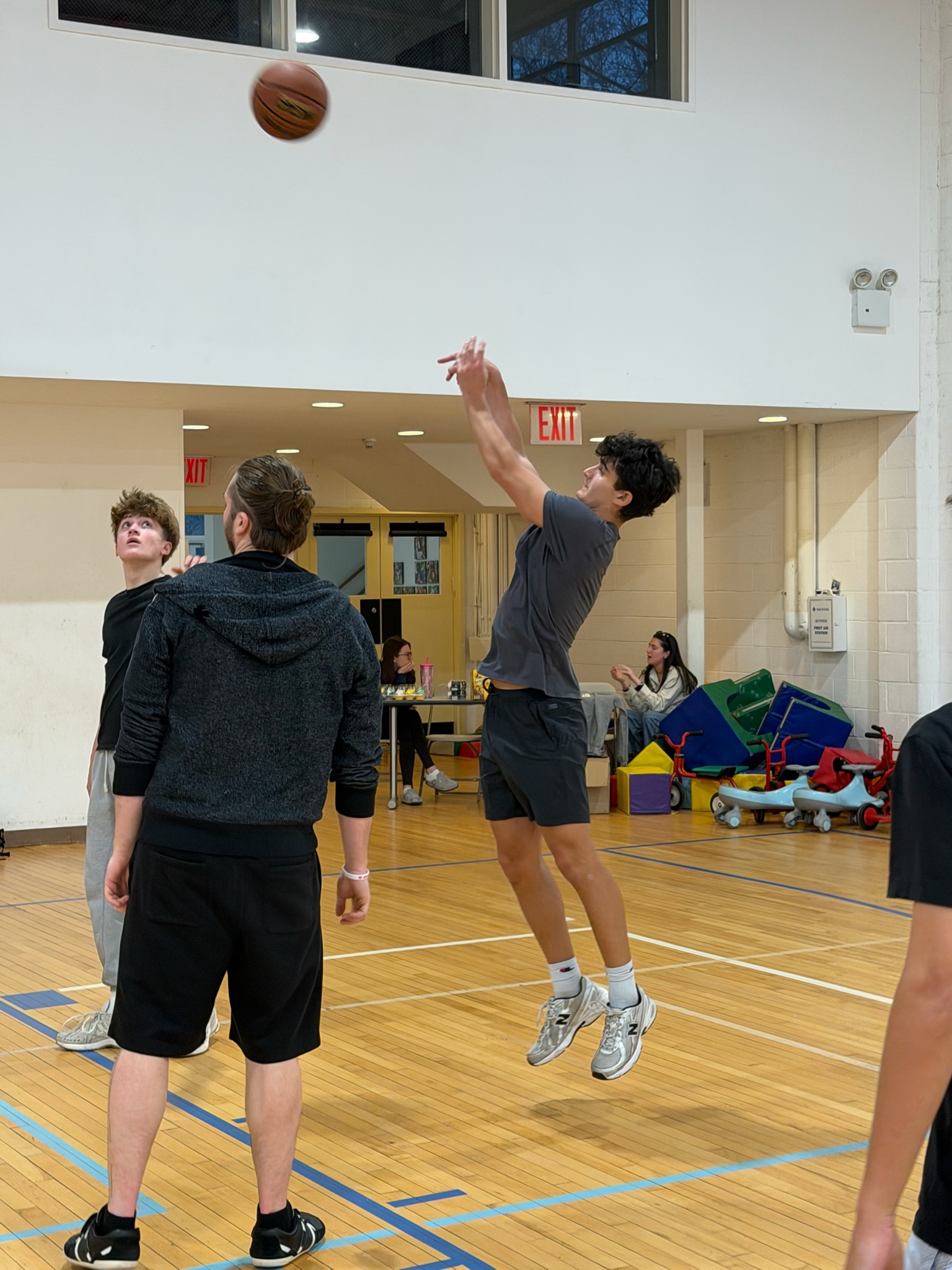 A player shooting a basketball during the Hila AZA and BBYO tournament